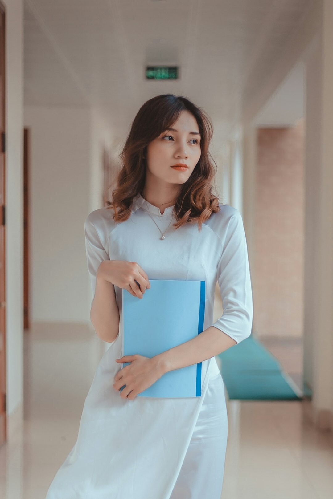 Portrait of a young European researcher holding a notebook
